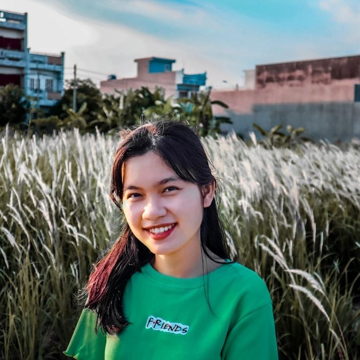 Kaveri Mehta, Lead Design Curator at MarshPlainHaven, reviewing corporate floral arrangements